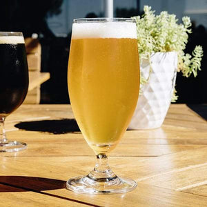 
                  
                    A Goblet 400ml Glass that is sitting in the sun, which has been fill with beer by the booze towers beer tower
                  
                